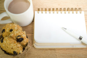 Notebook with coffee