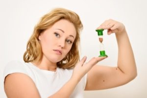 Woman with an hourglass in her hands