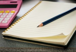 Notebook and calculator on a table