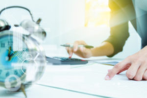 Business woman working on a task against the clock