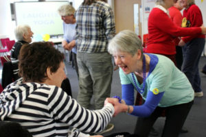 Caroline Carr giving a laughter yoga workshop