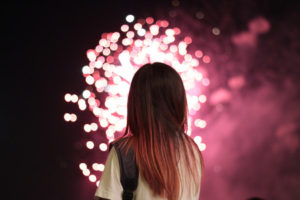 Young woman with fireworks