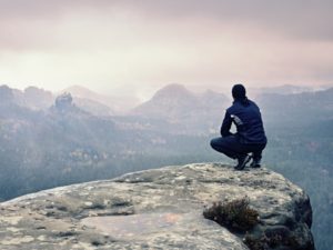 Woman on the top of a mountain